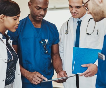 Doctors reading charts