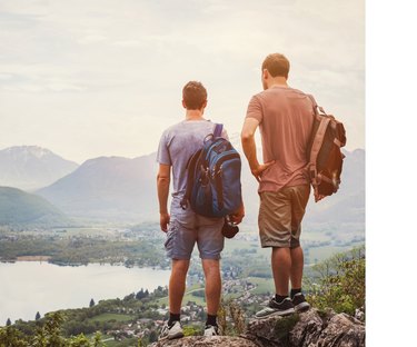 Two men after a hike looking out at the landscape