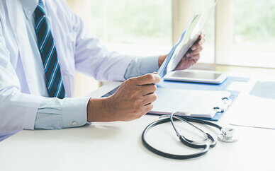 Faceless doctor diagnosing patient